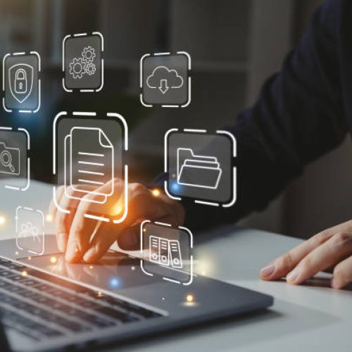 Businessman working on laptop with document management icon, Online document file management, database technology concept.